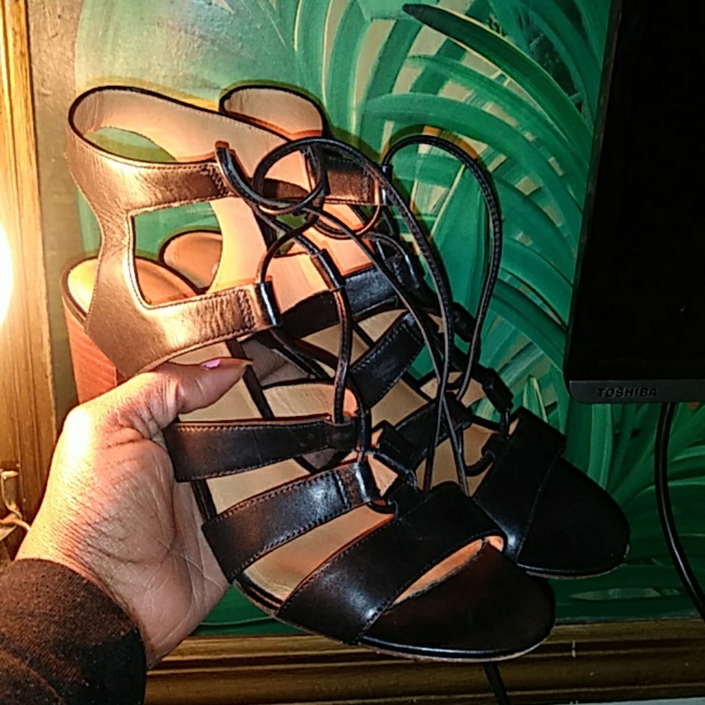 Black leather sandals.